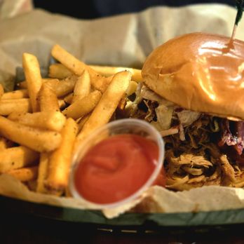 Foggy Mountain Brewpub signature dishes Pulled Pork Sandwich, PORK BÁNH MI SANDWICH, Jalapeno Mac Brat.